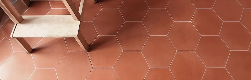 A high-end floor made with red cement tiles